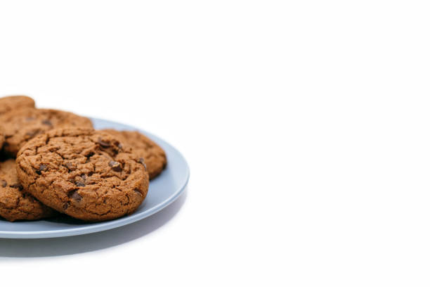 istock Chocolate chip cookies lie on a plate on a white background with free space for text 2197174408