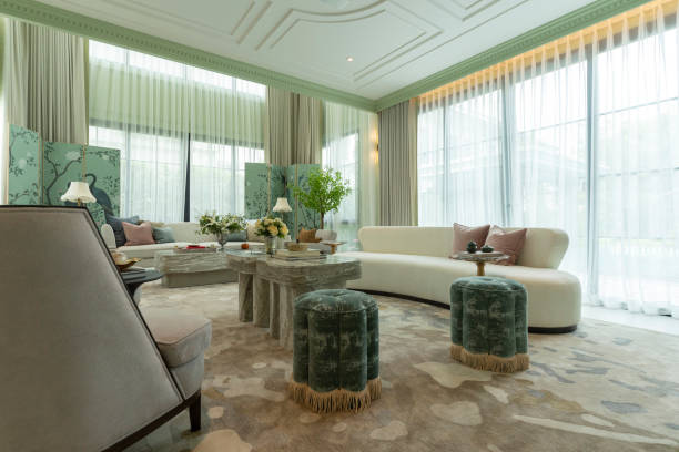 istock Interior of a luxurious sitting room with bay window sofas and coffee table. 2197179735