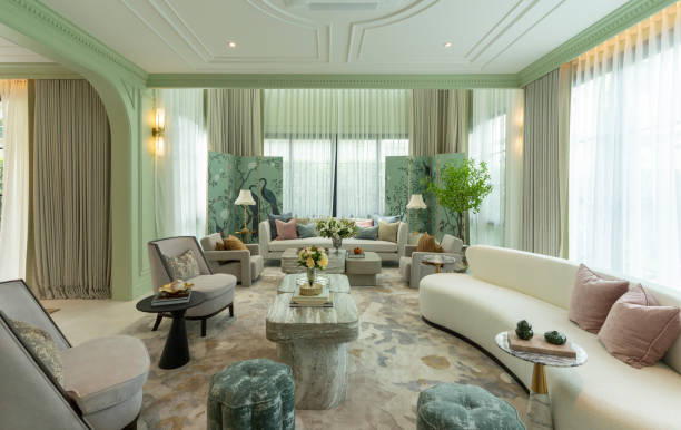 istock Interior of a luxurious sitting room with bay window sofas and coffee table. 2197179740