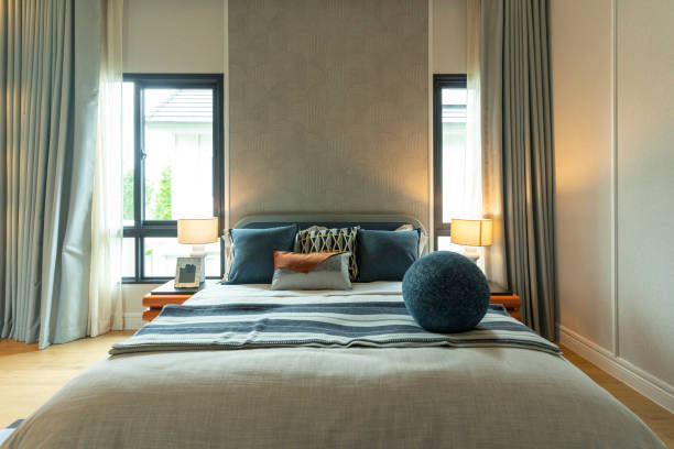 istock Modern cobalt blue bedroom with lamp, carpet and window. 2197179818