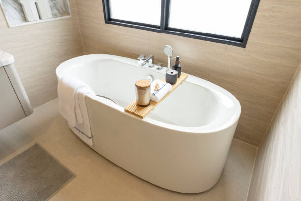 istock Minimalist freestanding bath tub in white modern bathroom. 2197179820