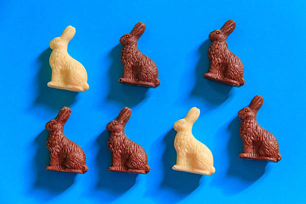 istock Easter chocolate bunnies on blue background. Top view 2197183033