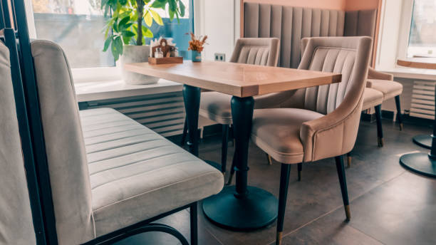 istock Empty beige upholstered chairs in a coffee shop in the morning 2197183390