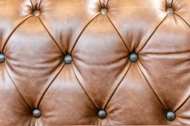 istock brown leather sofa armrest with carriage tie and brass rivets 2197183391