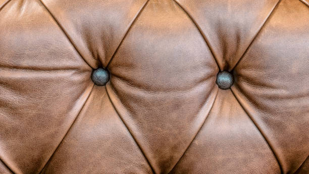 istock brown leather sofa armrest with carriage tie and brass rivets 2197183395