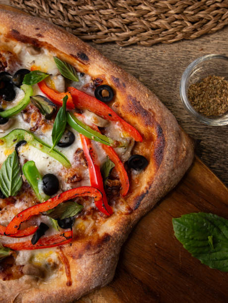 istock Homemade Sourdough pizza on Wooden Table. 2197188077