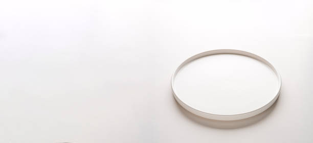 istock Top view of empty ceramic white plate on white background 2197188778