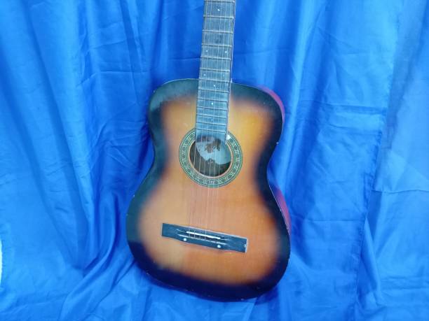 istock Acoustic Guitar on the blue background. Musical instrument. 2197191176