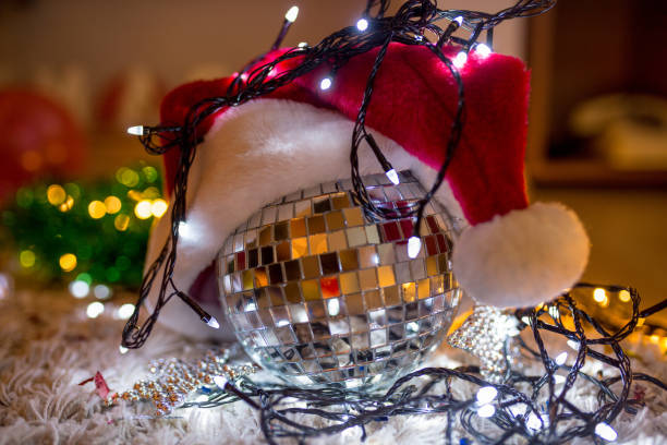 istock Christmas tree decorated with mirror disco ball. Ornament lighting and gliter decor for celebrate, merry Christmas and Happy new year. 2197195877