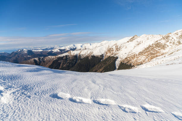 View from Monte Bregagnino towards Lake Como and Switzerland. snowy panorama at almost 2000mt
