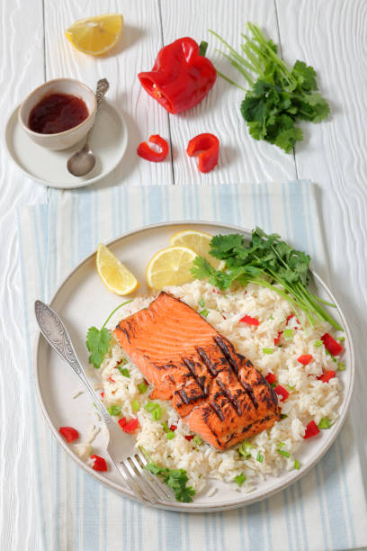 istock grilled red salmon fillet with rice, top view 2197199030