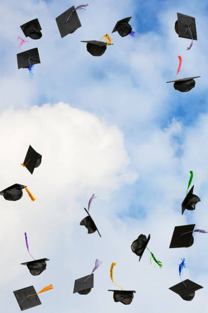 istock Graduation caps thrown in the sky 2197199084