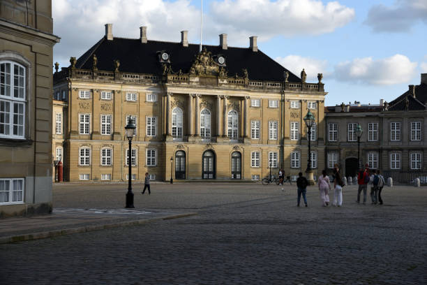Copenhagen, COP, Denmark - August 22, 2024: Amalienborg is official residence for the Danish royal family with national flag