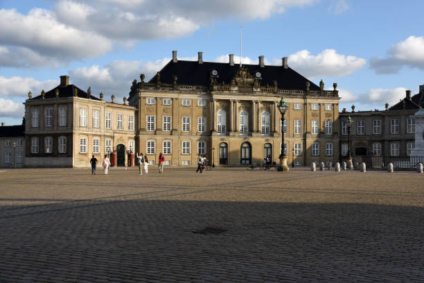 Amalienborg Slotsplads Copenhagen with the sourrounding official residence for the Danish royal family. Captured in the evening during summer season.