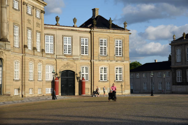 Amalienborg Slotsplads Copenhagen with the sourrounding official residence for the Danish royal family. Captured in the evening during summer season.