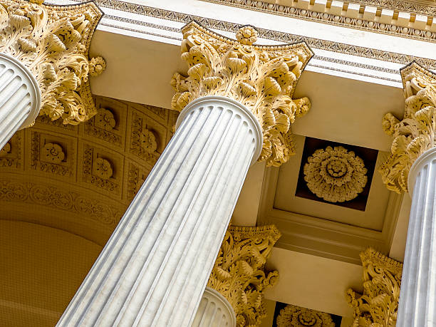 A high-quality render of an Ionic column showcasing intricate details of its capital and entablature. This image captures the elegance and sophistication of classical architecture, emphasizing the ornamental volutes and refined fluted shaft. Ideal for use in architectural presentations, design projects, historical references, and educational materials. The monochromatic aesthetic highlights the fine craftsmanship of classical Greek and Roman architecture.