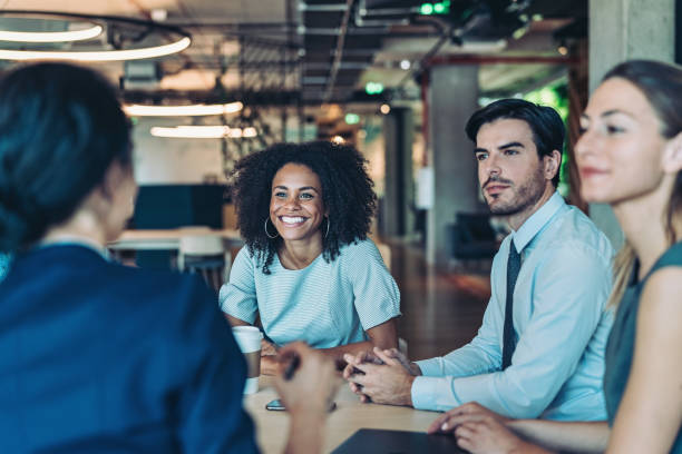 istock Multiracial group of business persons having a meeting 2197200076