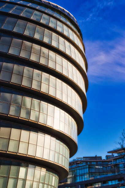 istock Modern Glass Building Facade and Adjacent Structure  in London, UK. 2197200524