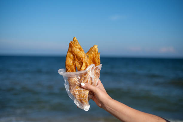 istock A woman's hand holding a delicious sweet baklava 2197200718