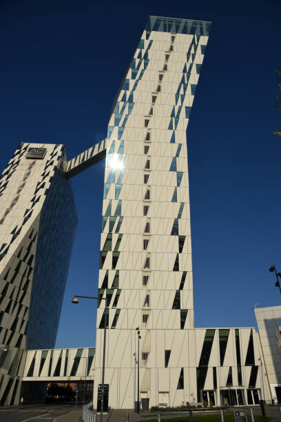 The AC Hotel Bella Sky Copenhagen, formerly the Bella Sky Comwell Hotel, is a 4-star conference hotel adjacent to the Bella Convention and Congress Center in the Ørestad district of Copenhagen, Denmark. The image shows the hotel captured during summer season.