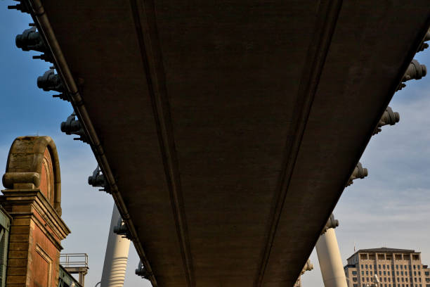 istock Underside of Concrete Bridge Structure with Brick Building and Sky  in London, UK. 2197206161