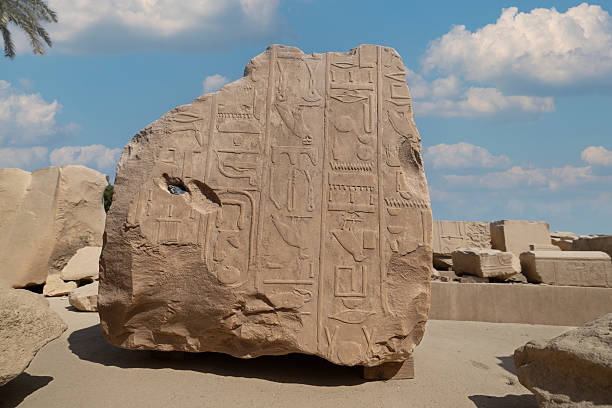 A large stone fragment with carved hieroglyphs.