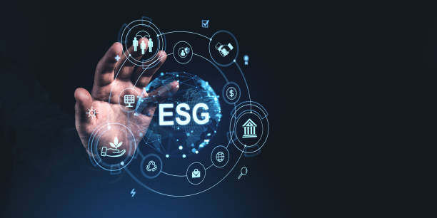 istock Hand reaching towards digital ESG icons on a dark background, representing environment, social, governance principles 2197207837