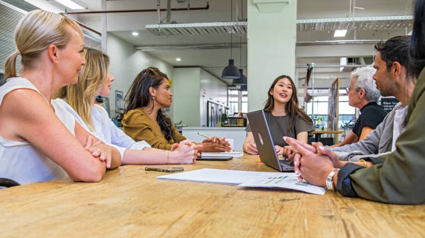 istock Diversity in Business: Low angle view, people meeting in a co-working space 2197210803