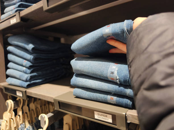Woman looking new clothes to buy in clothes store