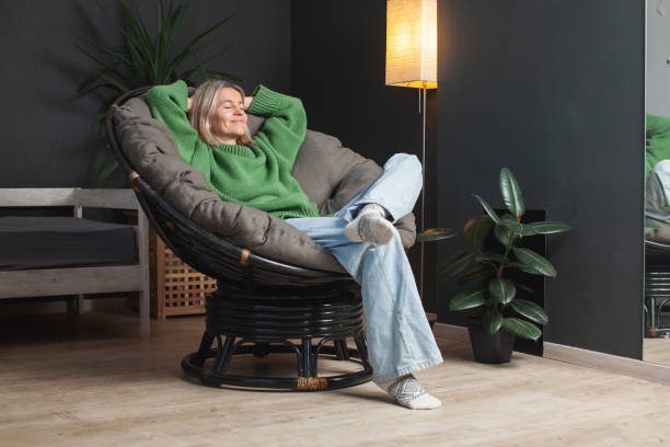 istock Happy middle aged Woman relaxing at home 2197212451