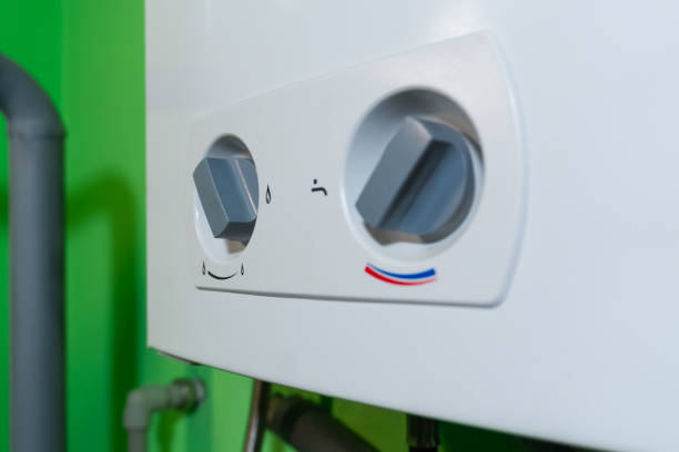 istock Temperature regulators on the combi gas boiler – clear markings allow for easy adjustment of a comfortable temperature. 2197213594