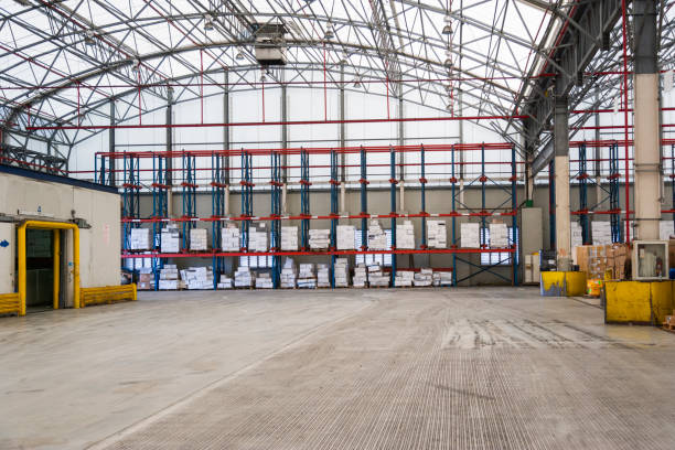 istock Storage warehouse with stacked cargo boxes and industrial shelving for logistics and distribution. 2197214558