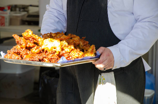 istock Preparing and serving food in a street kitchen 2197220536