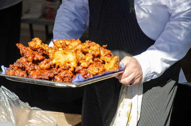 istock Preparing and serving food in a street kitchen 2197220575