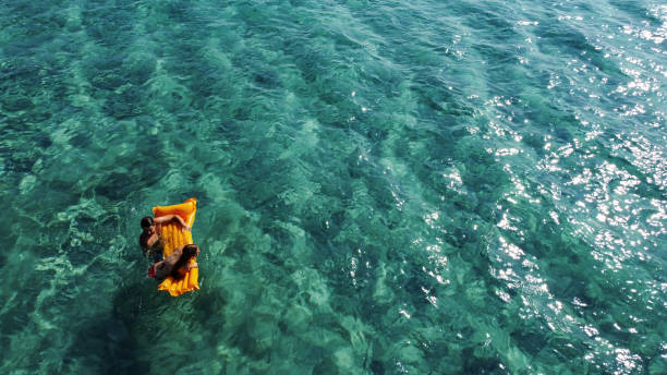 istock Enjoying on water float in the turquoise sea 2197221129