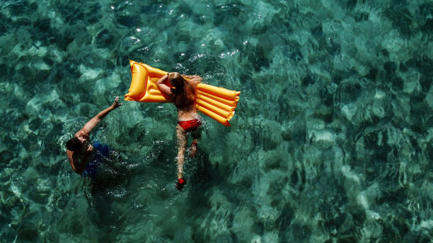 Friends relaxing in the ocean water