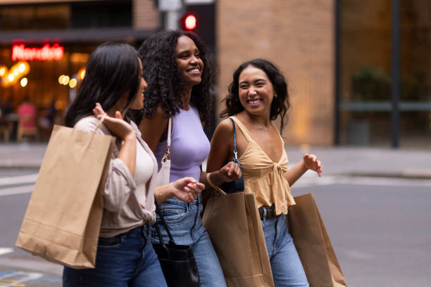 istock Friends carrying shopping bags 2197221193