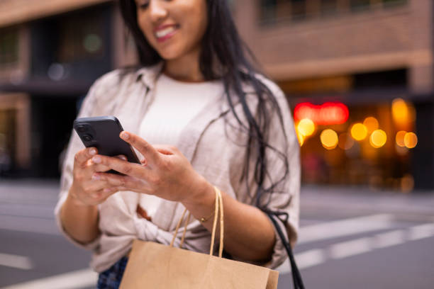 istock Stylish woman using phone 2197223084