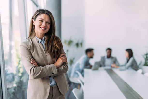 istock Confident businesswoman and her team. 2197223344