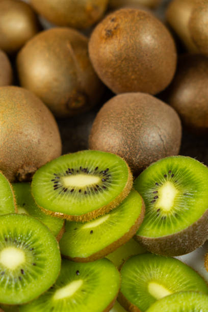 istock Fresh kiwi fruit, many whole and sliced kiwi 2197224568
