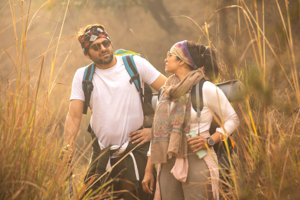 istock Tired young couple standing and resting in forest 2197226997