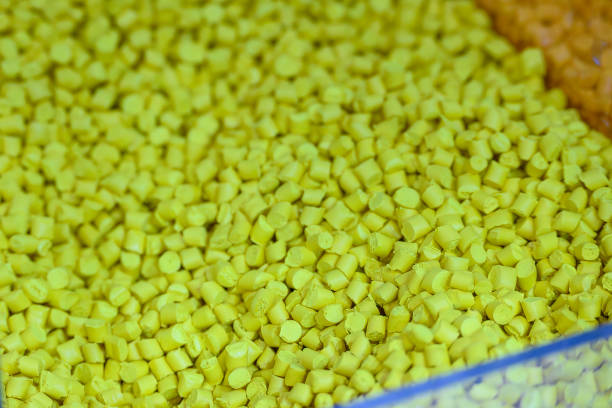 istock The pile of yellow pellets materials for plastic injection process. 2197229365