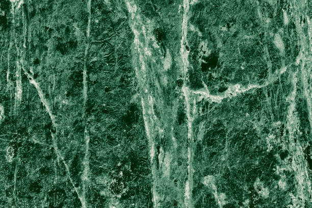 istock Real closeup of dark green marble stone texture surface background. Design pattern with high resolution for luxury home decoration. Abstract matt slab rock material. Front view of natural tiles stone surface. 2197230242