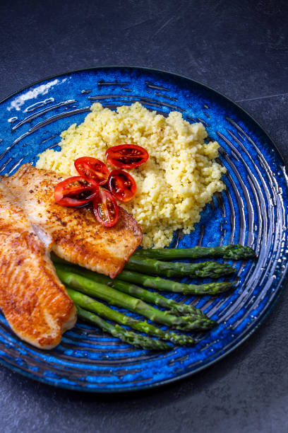 Green asparagus with fish fillet and couscous