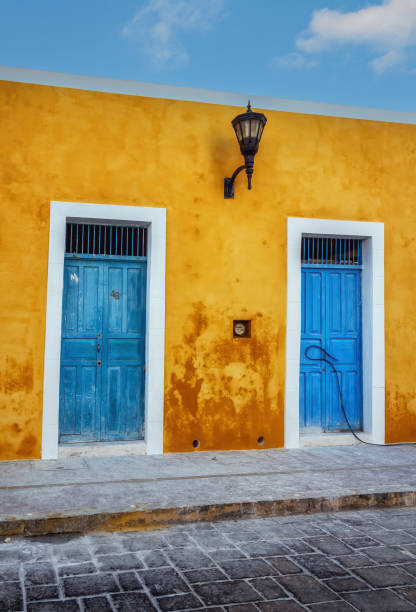 Blue door in yellow building.