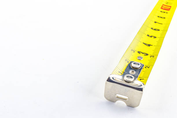 Metal construction tape measure, rolled measuring tape, tape measure on white background