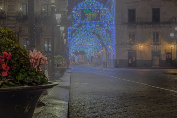 city ​​street with lights for the celebration, surrounded by a light fog