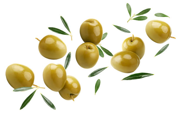 istock flying green olives with green leaves isolated on white background. clipping path 2197244537