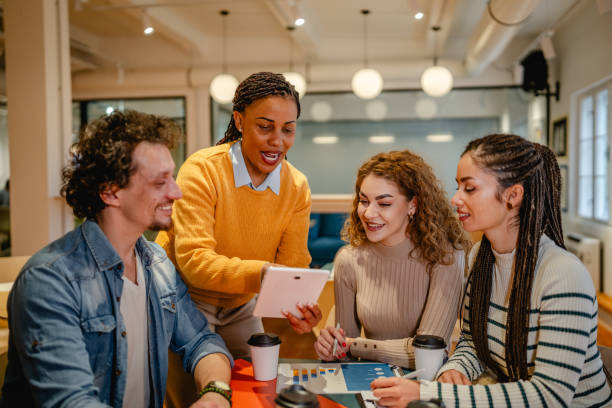 istock group of multicultural teamwork research together on tablet at office 2197248818