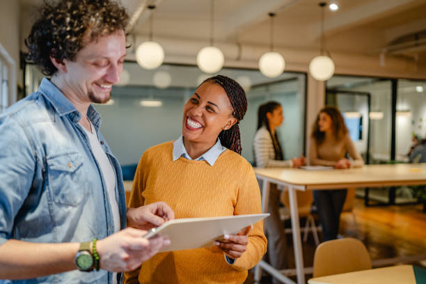 istock male and female multicultural colleague work together on clipboard 2197248965